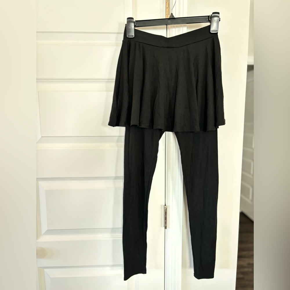 Small black cotton leggings with a skirt built over them. Never worn.
